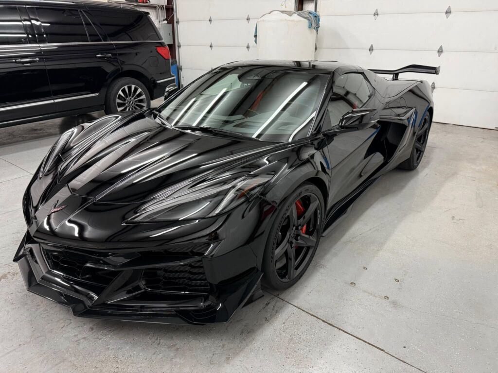 a car is wrapped by trainers at Apex Training Course